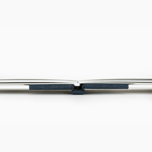 Side view of a layflat book lying completely flat at the spine