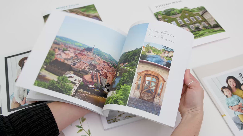 Flipping through a softcover travel photo book