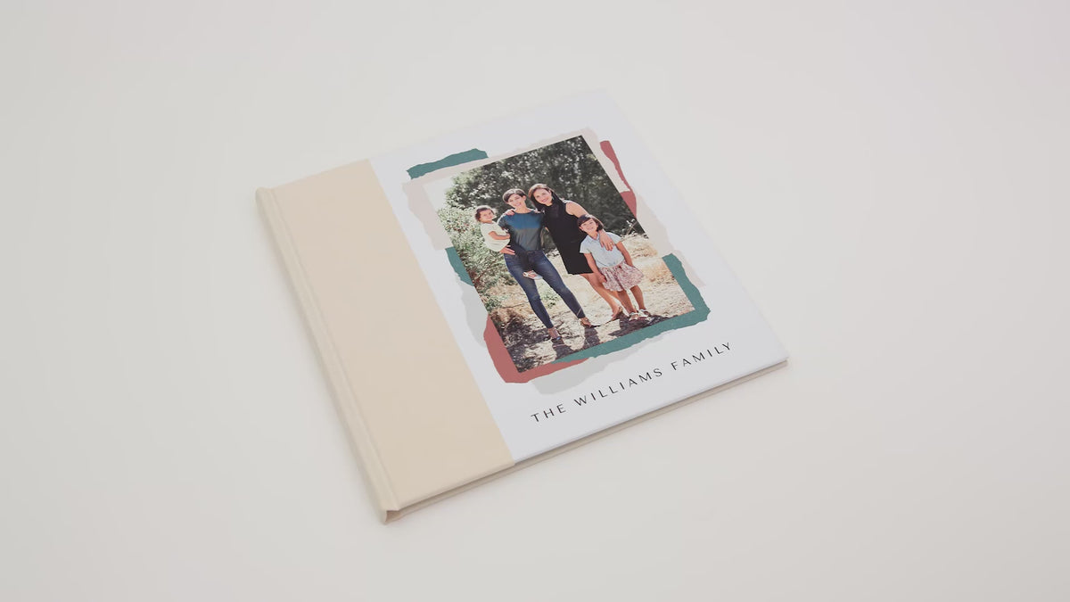 Stack of hardcover photo books with photo covers