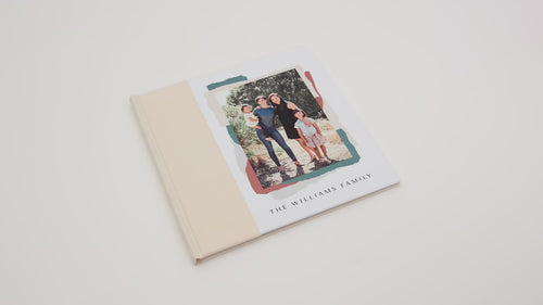 Stack of hardcover photo books with photo covers