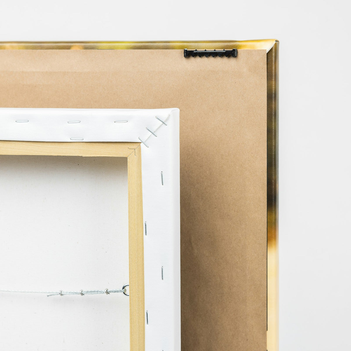 Back of a gallery wrap canvas showing the wood frame and hanger