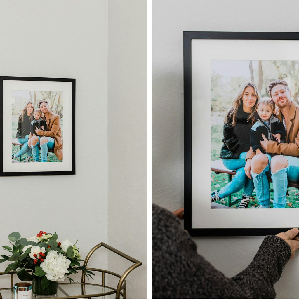 Black framed family photos on a wall