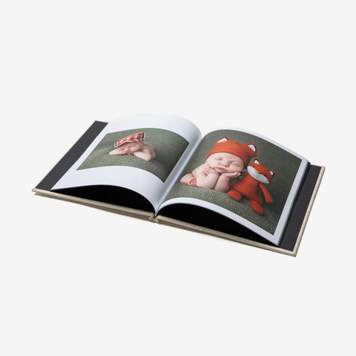 Hardcover photo book open to a two page spread