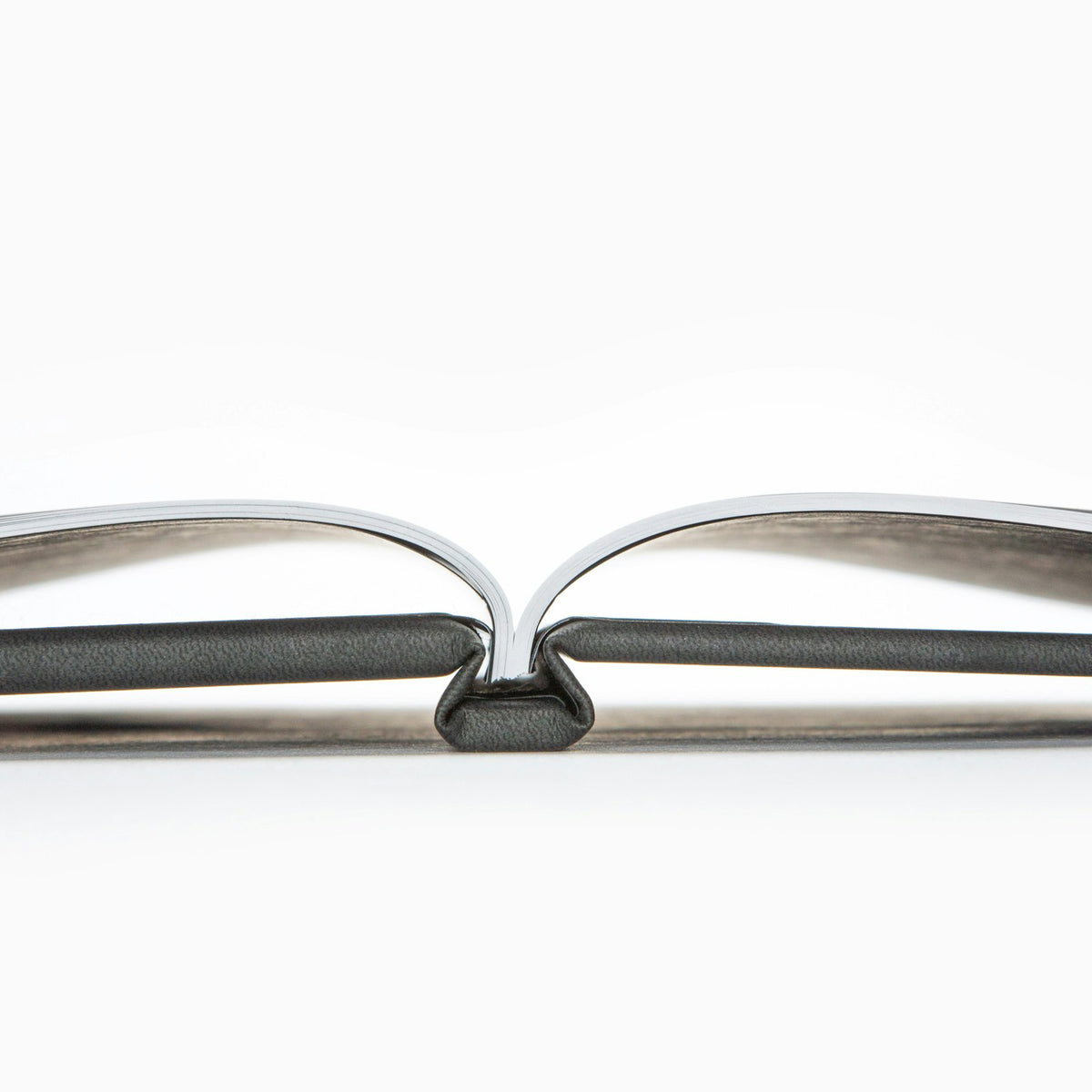 Side view of a hardcover photo book showing the bound spine