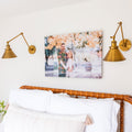Metal print of a couple hanging above a bed