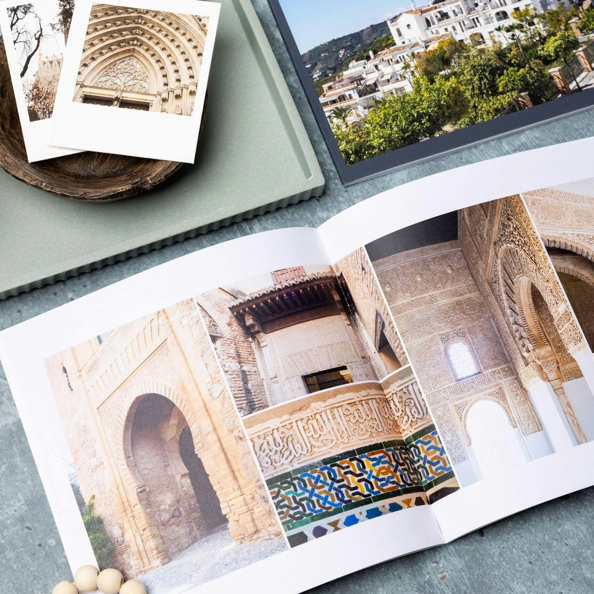 Softcover travel photo book open to a two page spread
